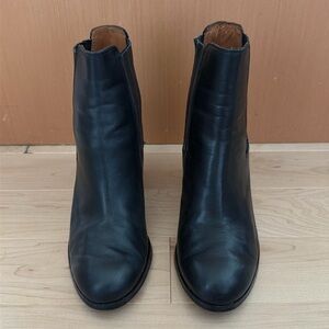 Black round toe heeled boots with elastic slip on